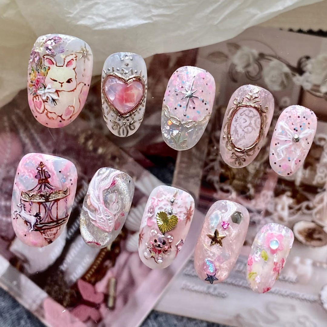 Whimsical Charm Short Oval Pink Press On Nail Set with Intricate Designs and Accents