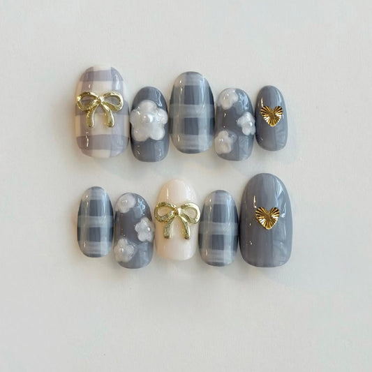 Chic Elegance Gray Medium Oval Press on Nail Set with Cute Bow and Heart Accents