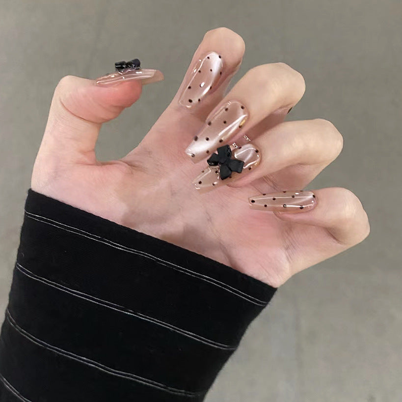 Chic Elegance Long Coffin Shaped Transparent Beige Nails with Unique Black Bow Accents