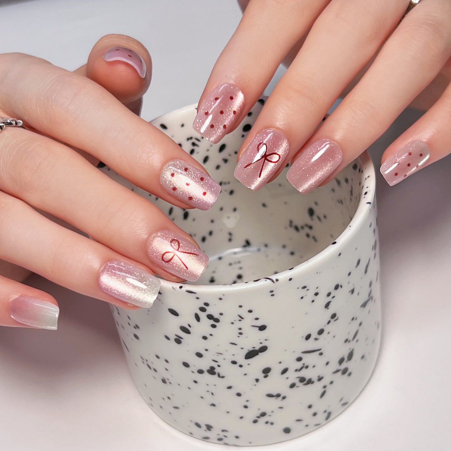 Charming Celebration Short Square Pink Press On Nail Set with Glitter and Artistic Ribbon Designs