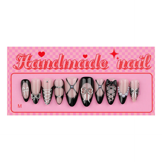 Chic Bowtie Vibe Medium Almond Pink and Black Press-On Nail Set with Unique Handcrafted Designs
