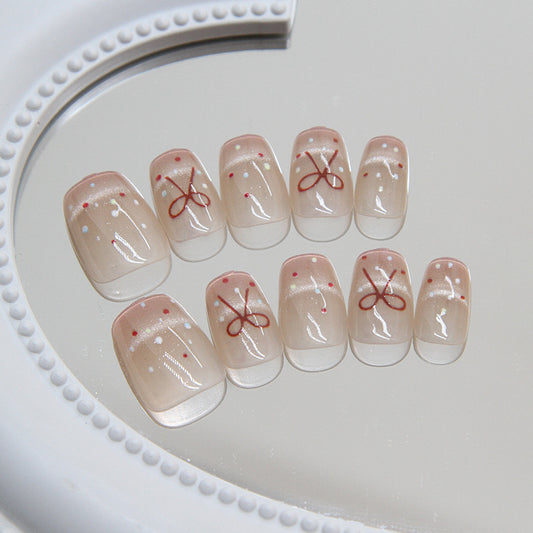 Elegant Affair Short Round Beige Press On Nail Set with Red Bow Design and Sparkle Accents