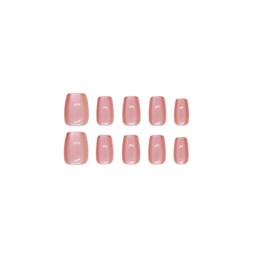 A set of pale pink, short coffin-shaped press-on nails with a shimmer finish.