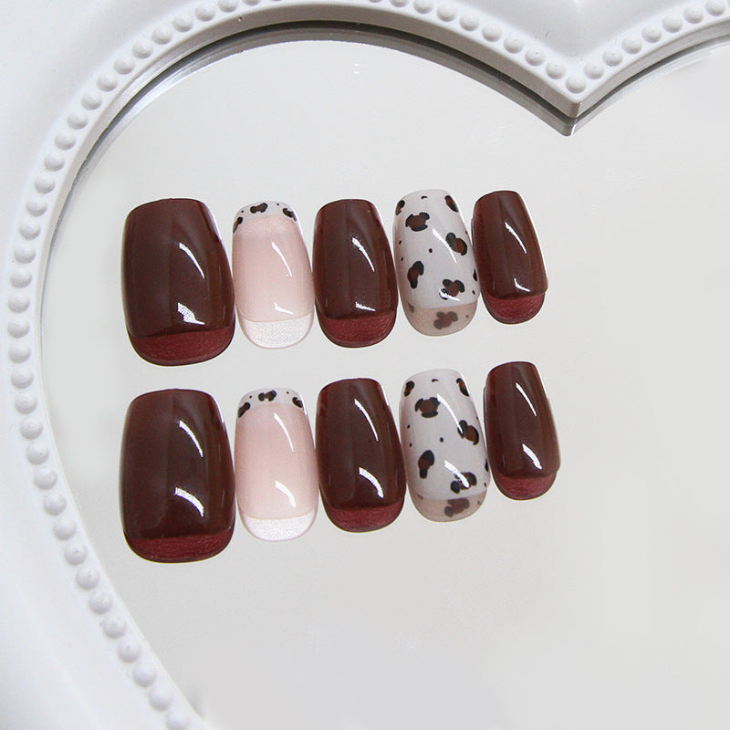 Chic Cowgirl Short Square Burgundy and Cream Press-On Nail Set with Adorable Cow Print Detail