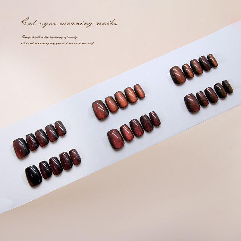 Set of brown nail extensions on a white strip with text on a beige background