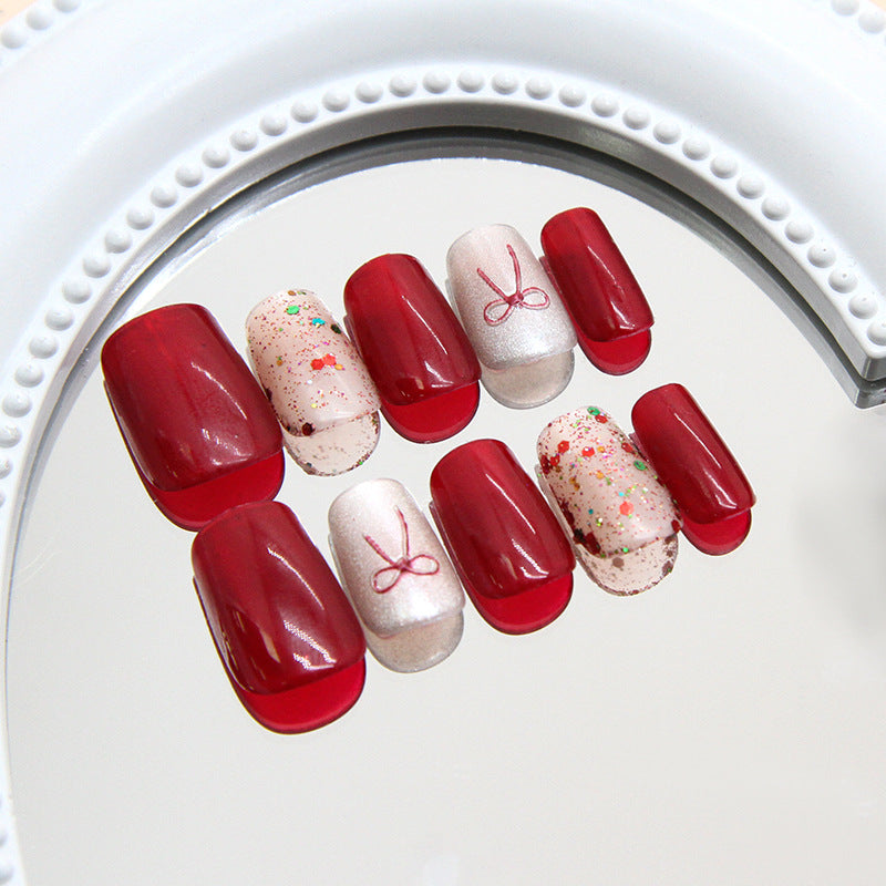 Charming Celebration Glossy Red Short Coffin Press On Nail Set with Glitter and Bow Accents