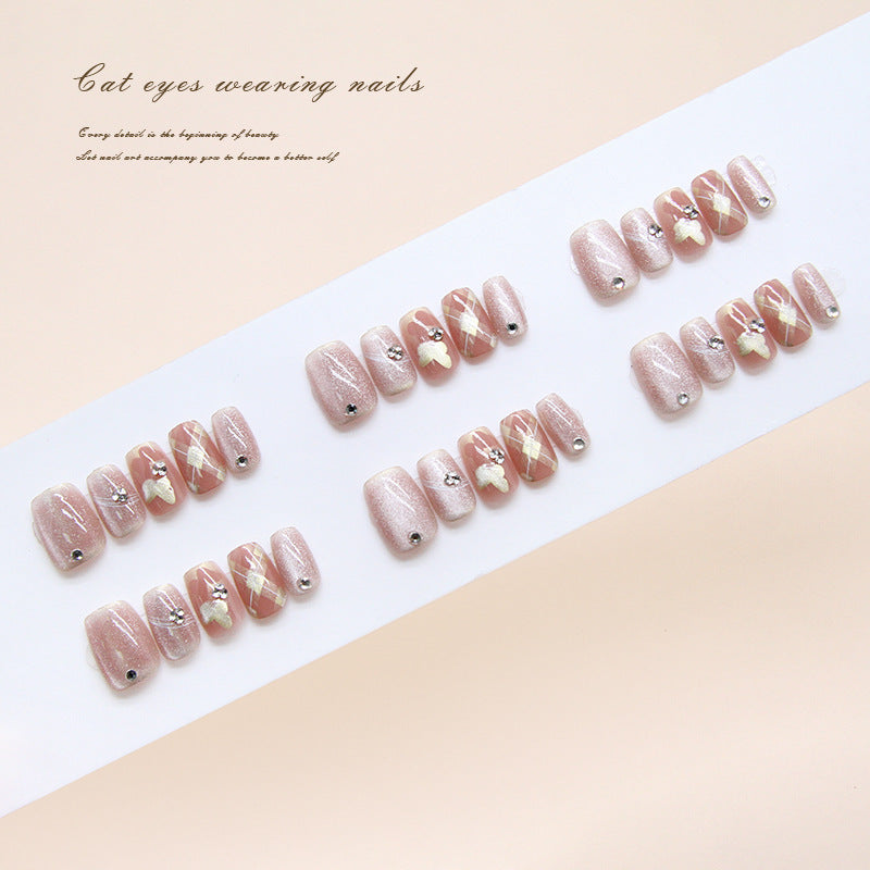 Charming Cat Eyes Press-On Nail Set in Short Square Shape with Soft Pink Color and Glittery Floral Accent