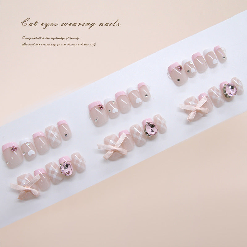 Whimsical Elegance Short Square Soft Pink Press On Nail Set with Cat Eye Design and Adorned Ribbons
