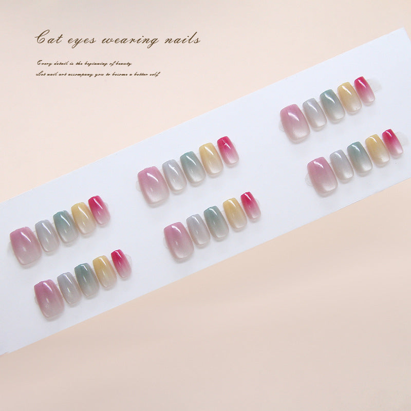 Set of gradient nail designs on a white paper with text on a beige background