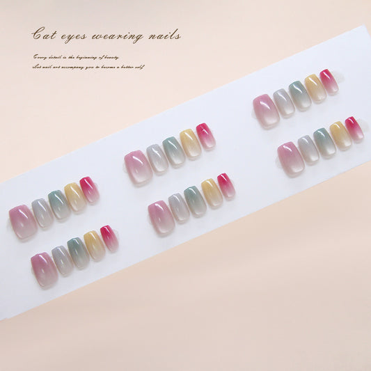 Set of gradient nail designs on a white paper with text on a beige background