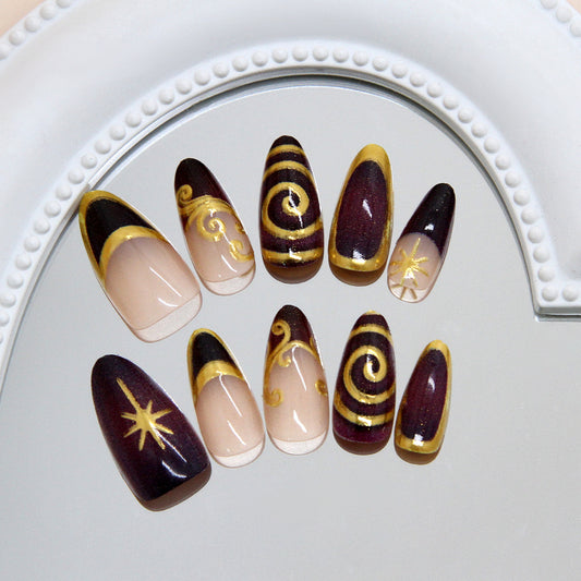 Celestial Glamour Long Almond Burgundy Press On Nail Set with Gold Accents and Intricate Swirl Designs