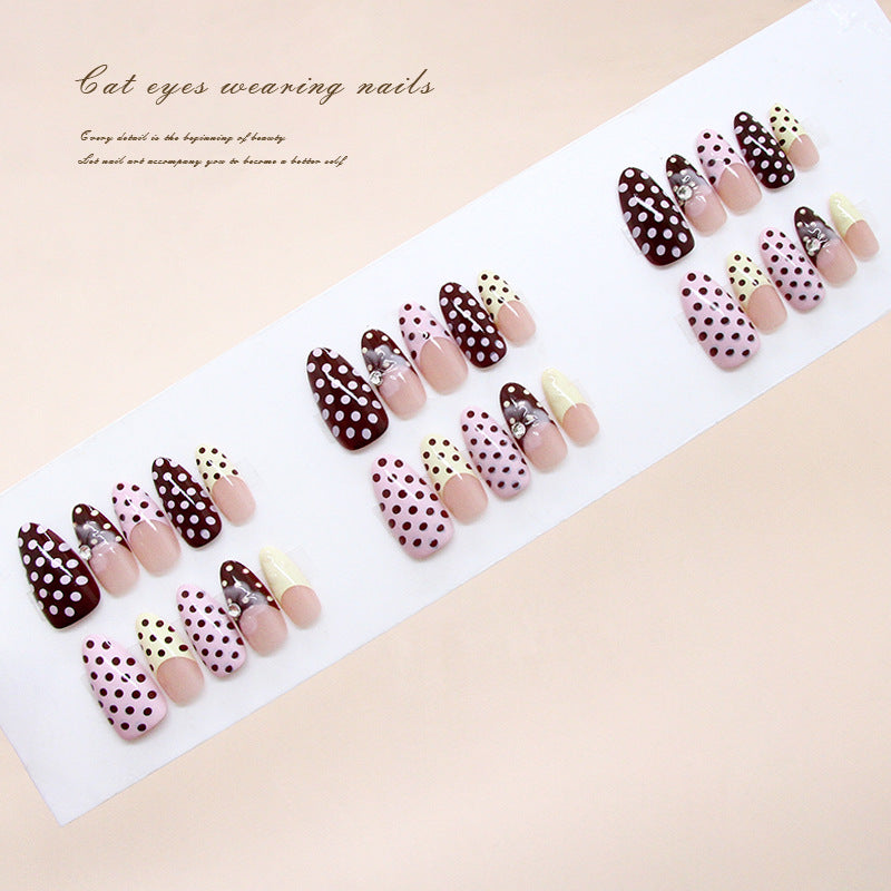 Whimsical Wonder Press-On Nails in Long Almond Shape with Striking Brown and Pink Polka Dots Featuring Elegant Rhinestone Accents