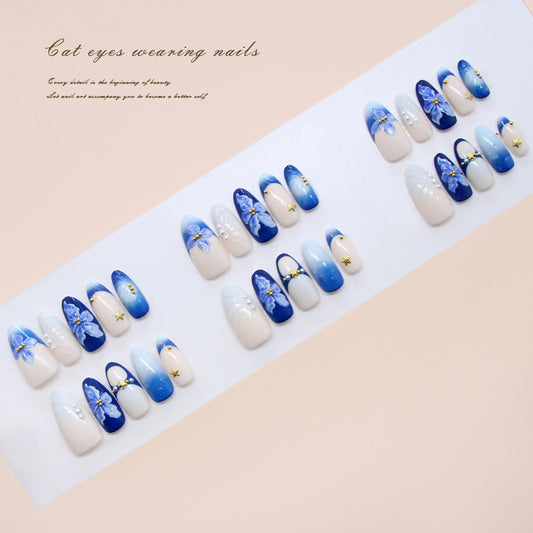 Enchanted Oasis Blue Long Almond Shaped Press On Nail Set with Floral Designs and Gold Accents