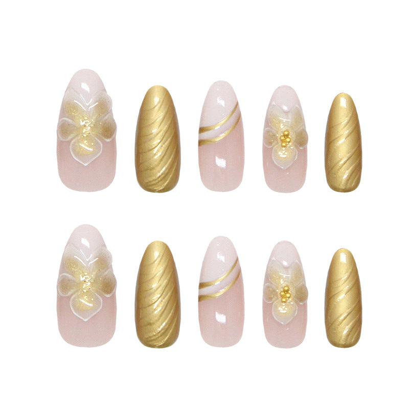 Elegant Blossom Inspired Press On Nail Set Stylish Long Almond Shape Soft Pink and Luxe Gold with Floral Design and Twisted Texture