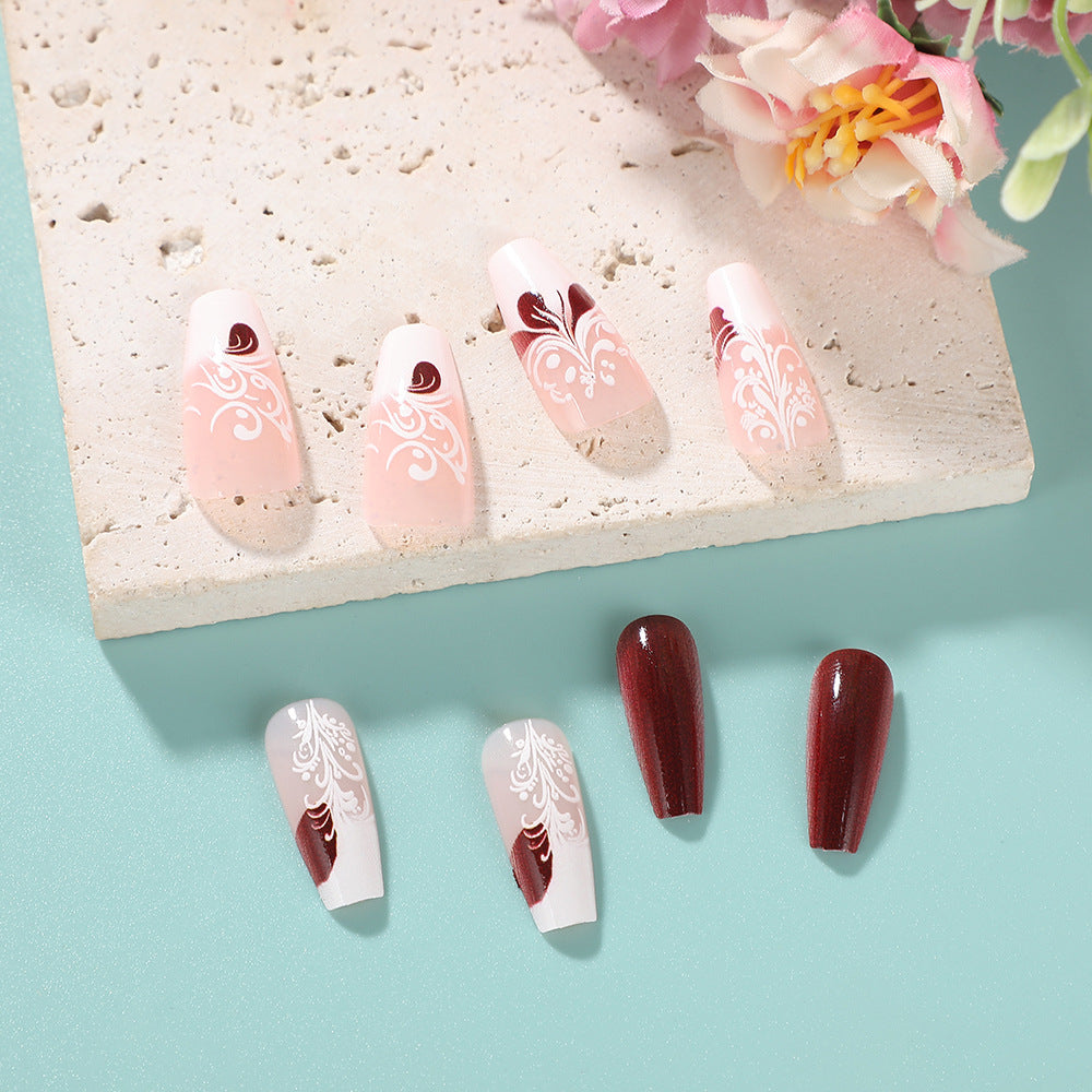 Elegant Blossom Press-On Nail Set in Medium Length Coffin Shape Soft Pink and Deep Red with Intricate Floral Design
