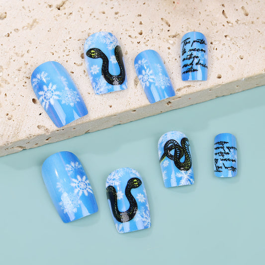 Winter Wonderland Snake Design Press On Nail Set in Medium Square Shape Icy Blue Color with Snowflakes and Mystical Quotes Feature