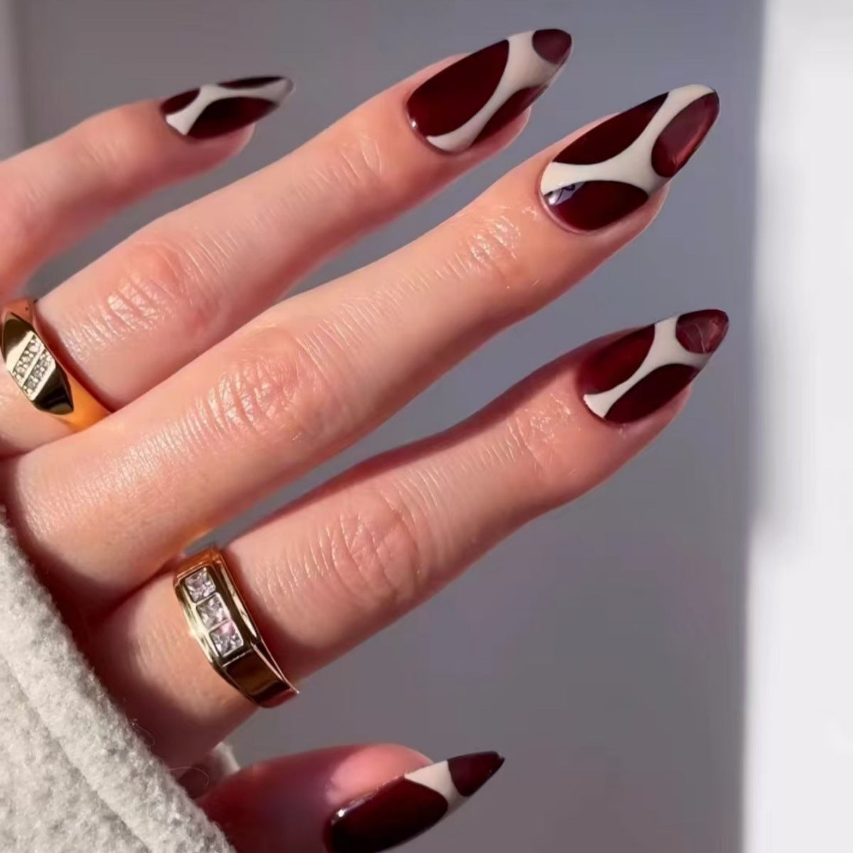 Chic Wine Red Long Almond Press On Nail Set with Unique Swirling Cream Design