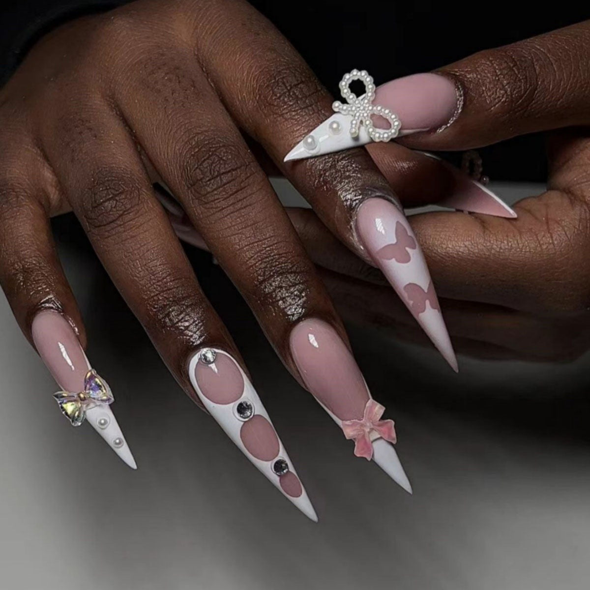 Whimsical Elegance Long Stiletto Shape Pink and White with Charming Butterfly and Pearl Accents Nail Set