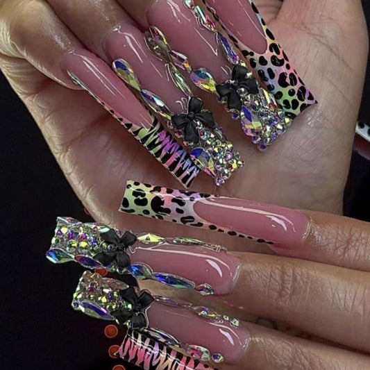 Wild Glamour Long Square Pink Nails with Vibrant Animal Print and Dazzling Rhinestone Embellishments