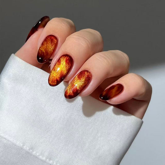Autumnal Radiance Medium Oval Shaped Amber Ombre Nails with Sparkling Finish