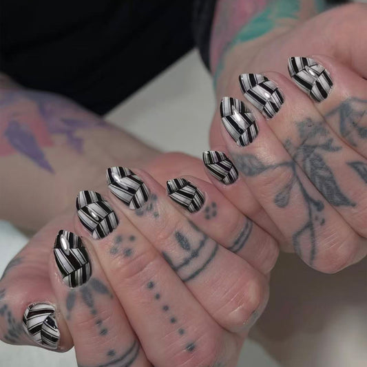 Gothic Elegance Medium Oval Black and White Striped Press On Nail Set with Glossy Finish