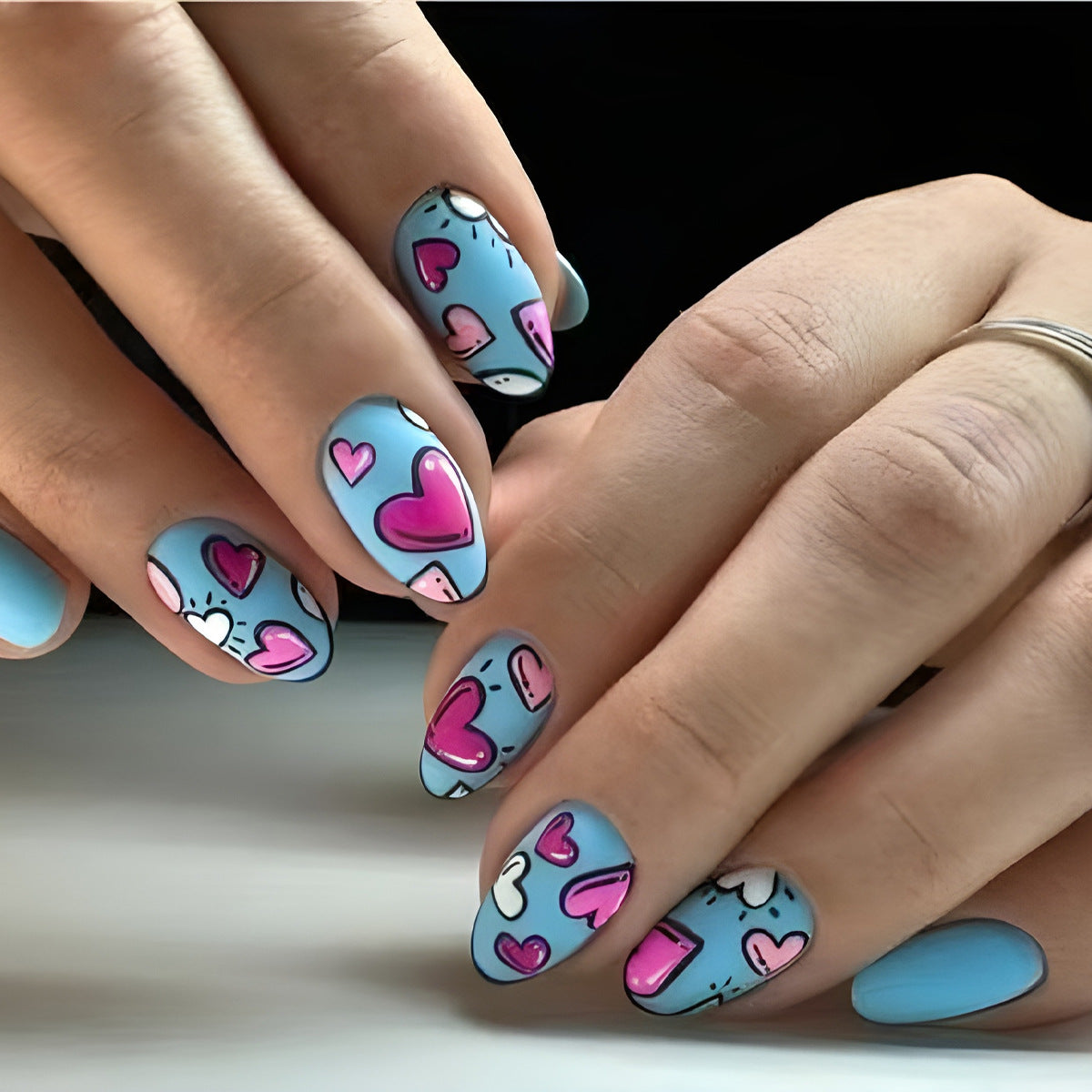 Whimsical Hearts Medium Almond Blue Press On Nail Set with Unique Hand-Drawn Design