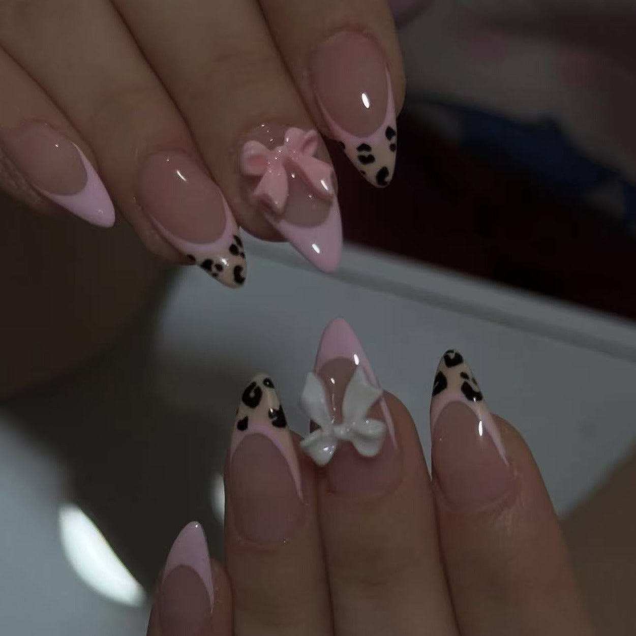 Chic Jungle Elegance Medium Almond Glossy Pink Leopard Print with Charming Bow Accents Nail Set