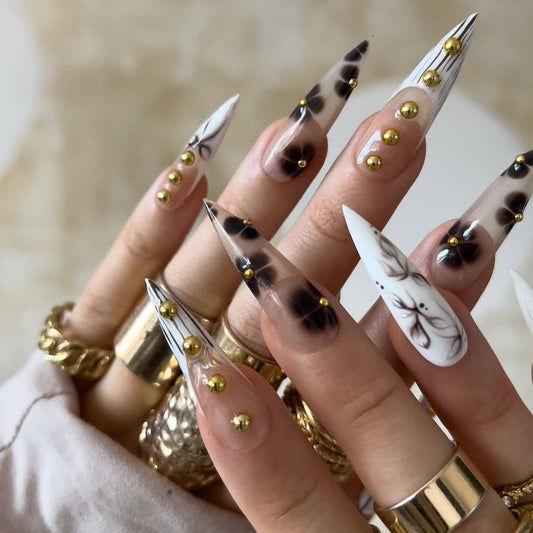 Glamorous Elegance Long Stiletto Ombre White and Black Press On Nail Set with Enchanting Gold Studs