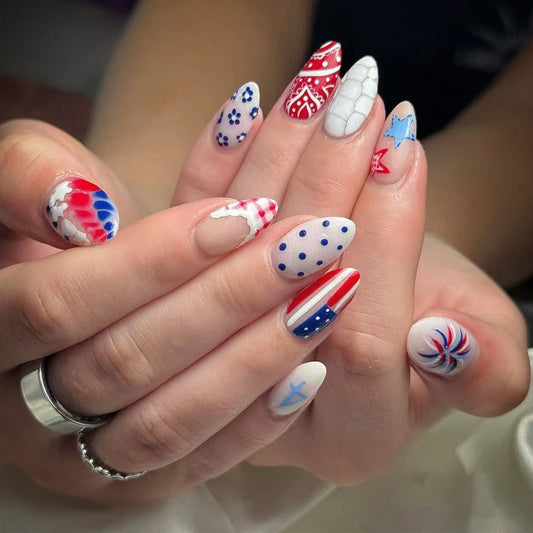 Patriotic Vibes Medium Almond Red White and Blue Nail Set with Unique Artistic Designs