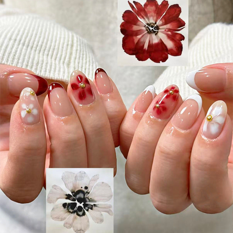 Floral Elegance Long Oval Red White Nails with Charming Flower Accents