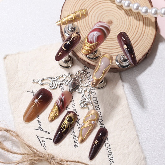 Mystical Elegance Long Almond Maroon with Gold Accents and Unique Celestial Designs Press On Nail Set