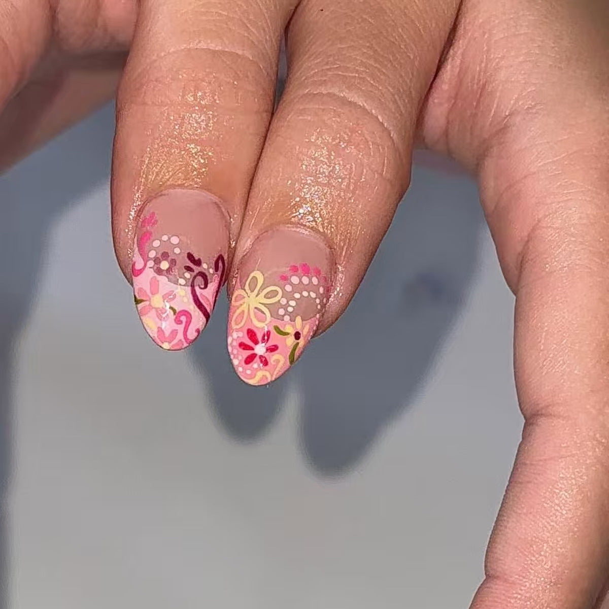 Floral Fantasy Medium Almond Pink Nail Set with Vibrant Botanical Accents