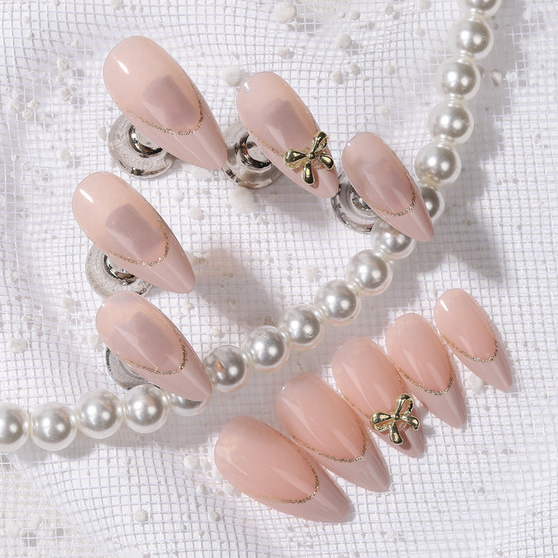 Elegant Blossom Press On Nails Long Almond Shape Soft Pink Color Adorned with Charming Gold Bow