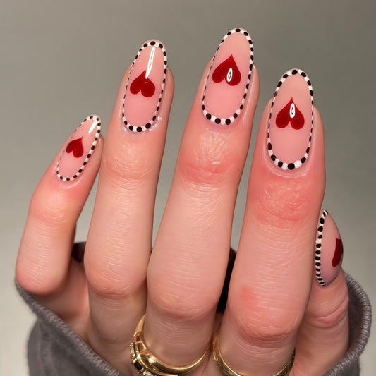 Romantic Elegance Long Oval Shaped Light Pink Press On Nail Set with Heart Design and Black Dotted Edges