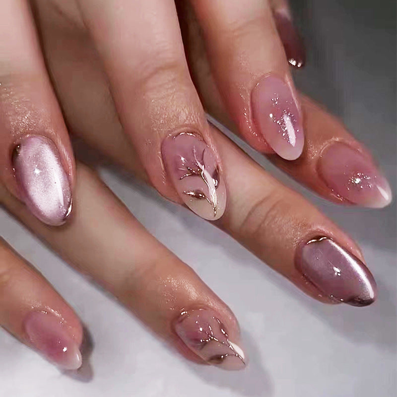Enchanted Elegance Medium Almond-shaped Pink Press On Nail Set with Shimmering Accents and Leaf Detail