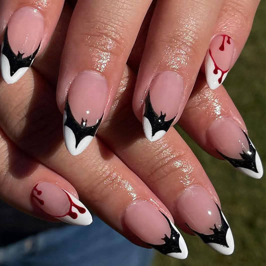 Gothic Elegance Medium Almond Black and White Bat Wing Accented Press On Nails with Red Drip Detail