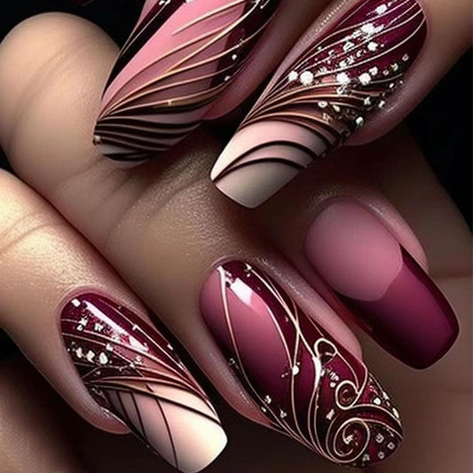 Enchanted Elegance Long Oval Burgundy Press On Nails with Glitter Accents and Artistic Swirl Design