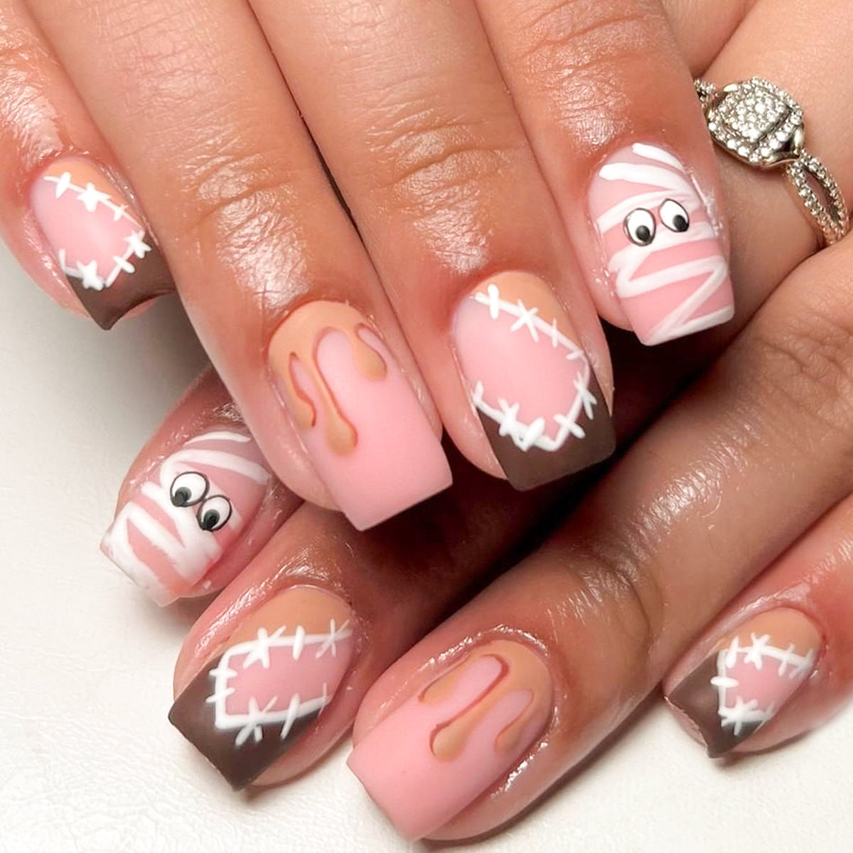 Spooky Mummy Themed Short Square Pink and Brown Press On Nail Set with Fun Mummy and Dripping Designs