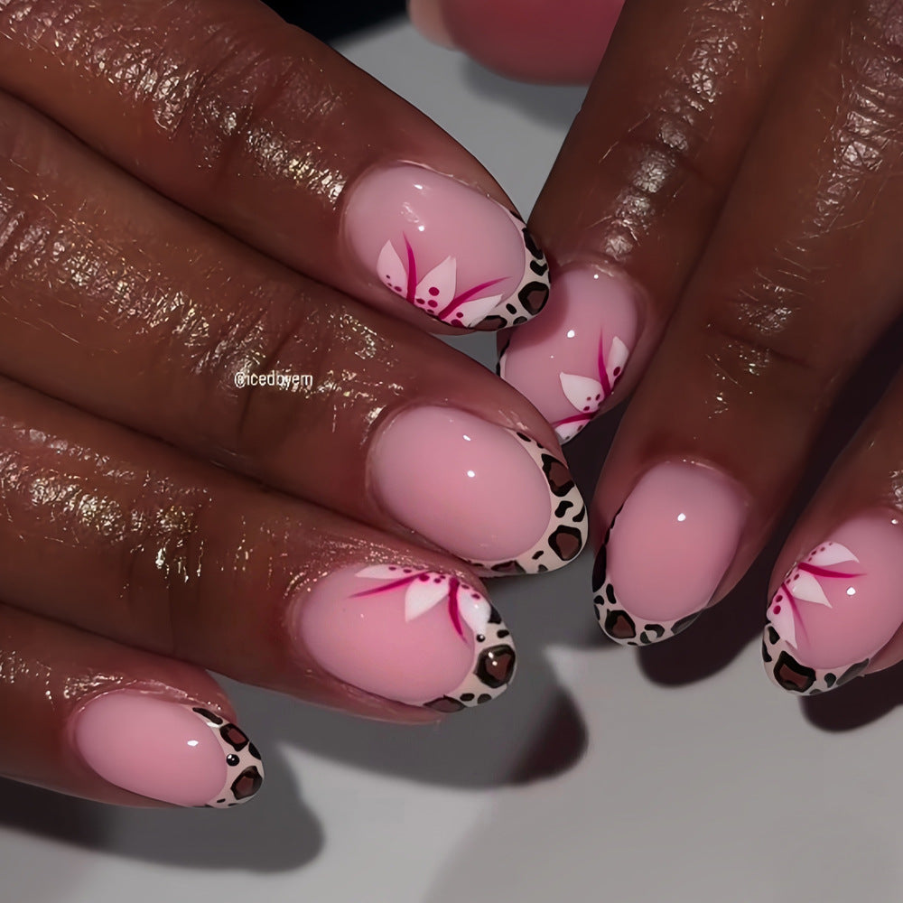 Tropical Bliss Elegant Short Oval Shaped Soft Pink Nails with Chic Leopard Print Tips and Floral Accents