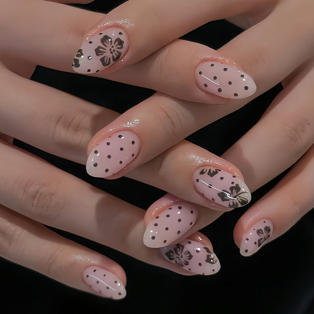 Whimsical Floral Dream Press On Nail Set Medium Almond Pink with Dotted Patterns and Elegant Black Designs