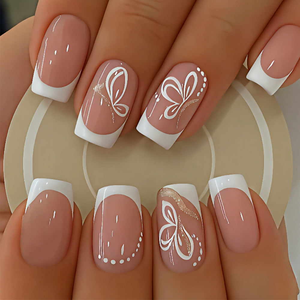 Whimsical Elegance Medium Square Beige Nails with White French Tips and Delicate Butterfly Designs