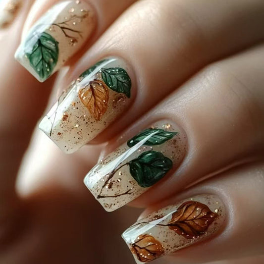 Nail art with leaf designs on a neutral background