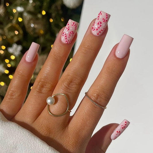 Festive Candy Cane Inspired Medium Square Pink Press On Nails with Whimsical Holiday Design