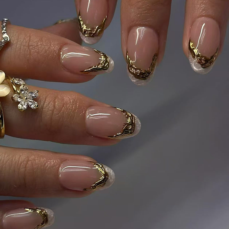 Gilded Elegance Medium Almond Beige Nails with Golden Wave Detailing