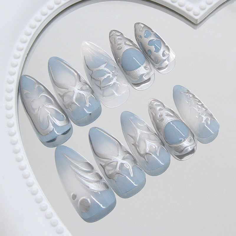 Enchanting Ocean Breeze Medium Almond Shaped Frosted Light Blue Press On Nail Set with Intricate Shell Motifs