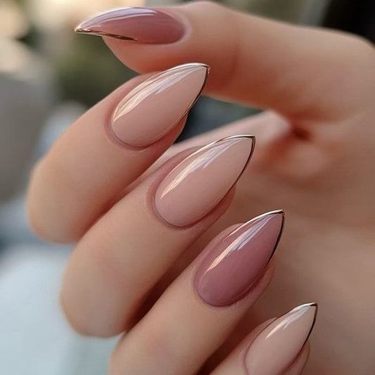 Close-up of a hand with almond-shaped nails featuring a gradient design.
