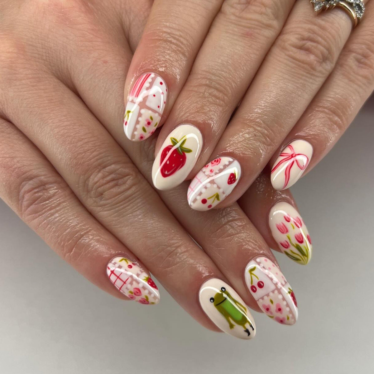 Whimsical Blossom Pink Short Almond Press-On Nail Set with Artistic Floral Designs