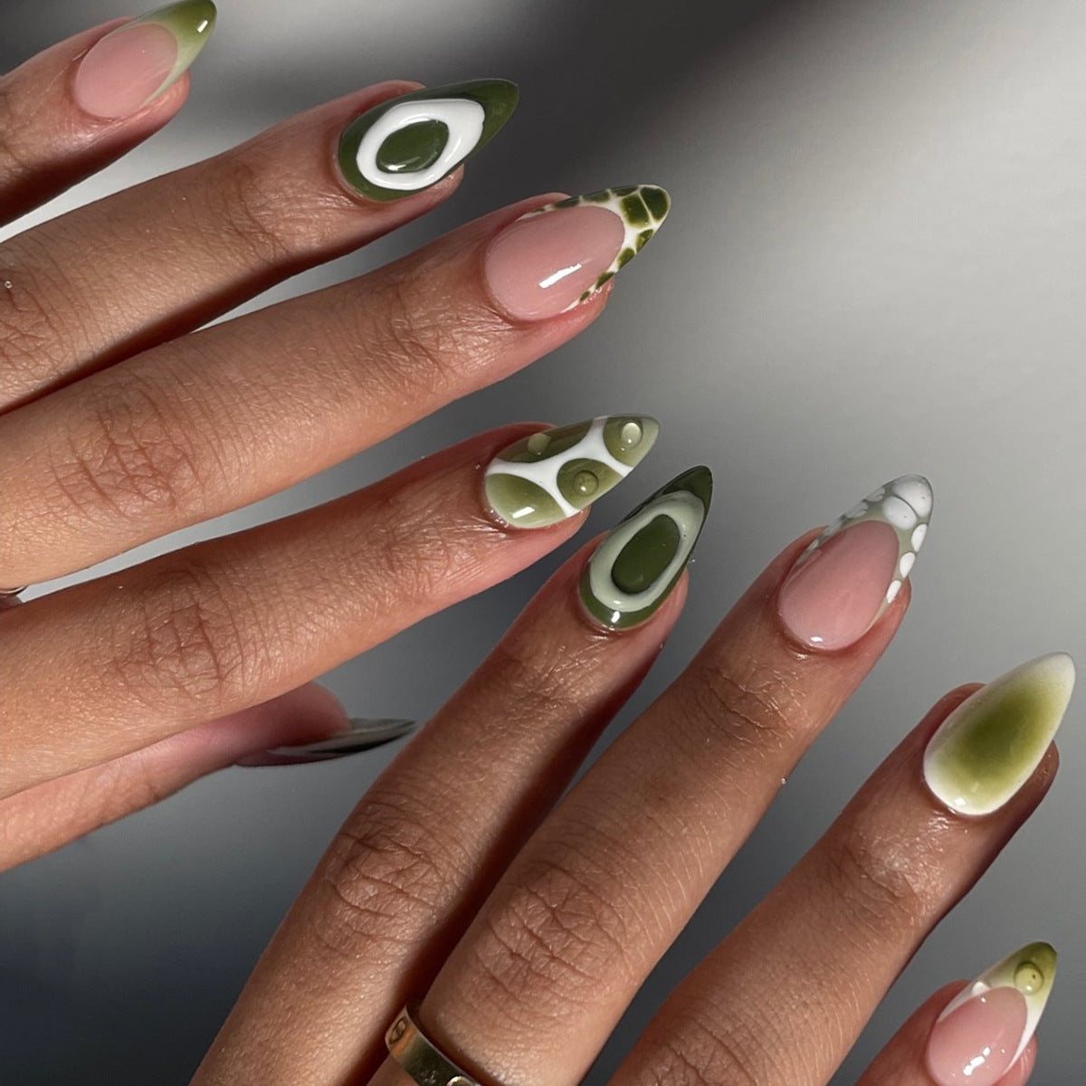 Nature's Elegance Medium Almond Shaped Green and Pink Press on Nail Set with Unique Abstract Patterns