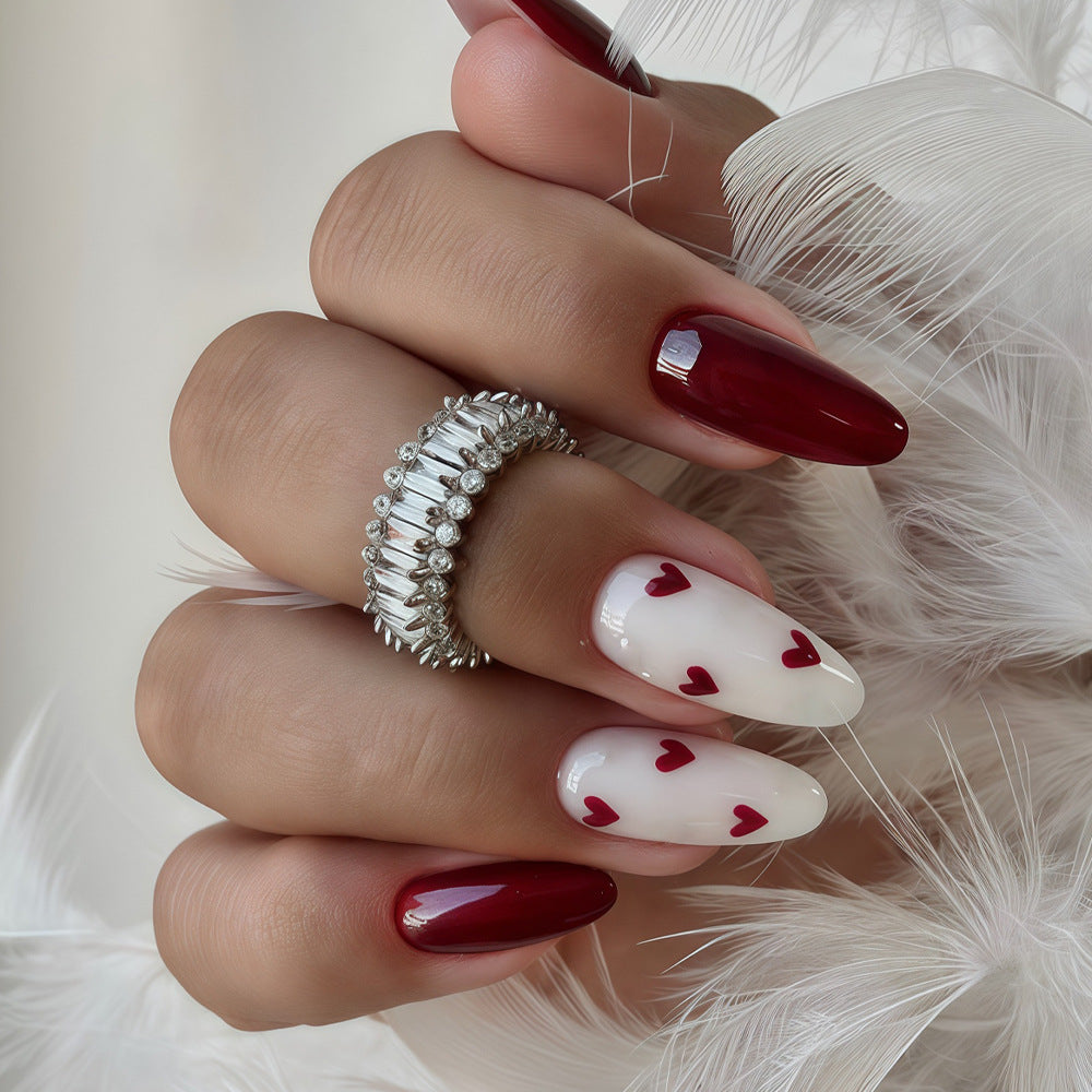 Romantic Elegance Glossy Long Almond Shaped Red and White Nail Set with Heart Accents