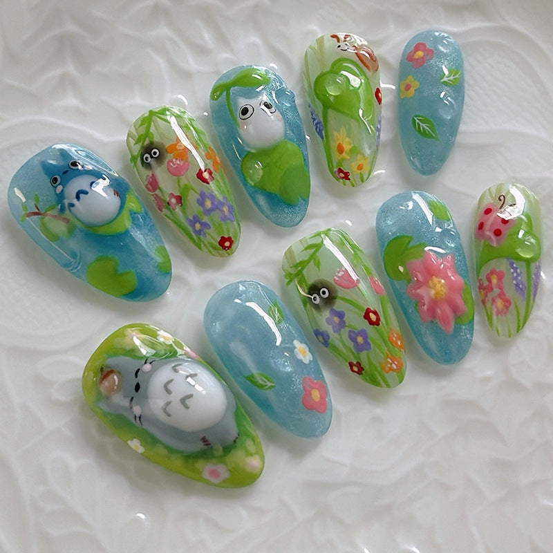 Whimsical Forest Themed Long Almond Shape Sky Blue Press On Nail Set with Charming Floral and Character Designs